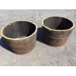 A pair of oak barrel tubs, the staves each bound by three metal strap bands. (25in x 17in) (2)