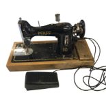 A Pfaff 30 sewing machine by Sew-Tric Ltd with control pedal and power cable, on hardwood stand with