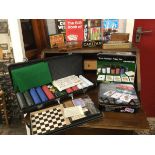 Three boxed poker sets including baize, sets of cards, etc., - one with large locking case; and a