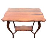 A rectangular satin walnut occasional table with scalloped moulded top on sabre legs joined by