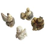 Four signed Japanese ivory netsukes, three with stained decoration - figures, snakes, musical pipes,