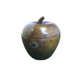 An apple shaped turned hardwood tea caddy, the hinged lid with protruding stalk, having silvered