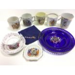 A collection of commemorative ceramics including Victorian mugs, an enamelled tin beaker with
