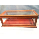 A Victorian mahogany bijouterie cabinet, the glass case with drop-down front panel, with moulded