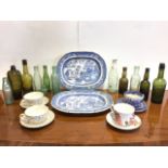 A pair of nineteenth century blue & white willow pattern ashets; a collection of twelve dug-up old