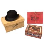 A boxed bowler hat by Scotts of 1 Old Bond Street; a boxed 500 piece 1950s wood hunting jigsaw;
