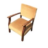 A mahogany cottage armchair with padded back and upholstered sprung seat on square legs.