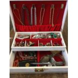 A jewellery box containing rings, brooches, pendants, beads, a coin bracelet, a stud box, cufflinks,