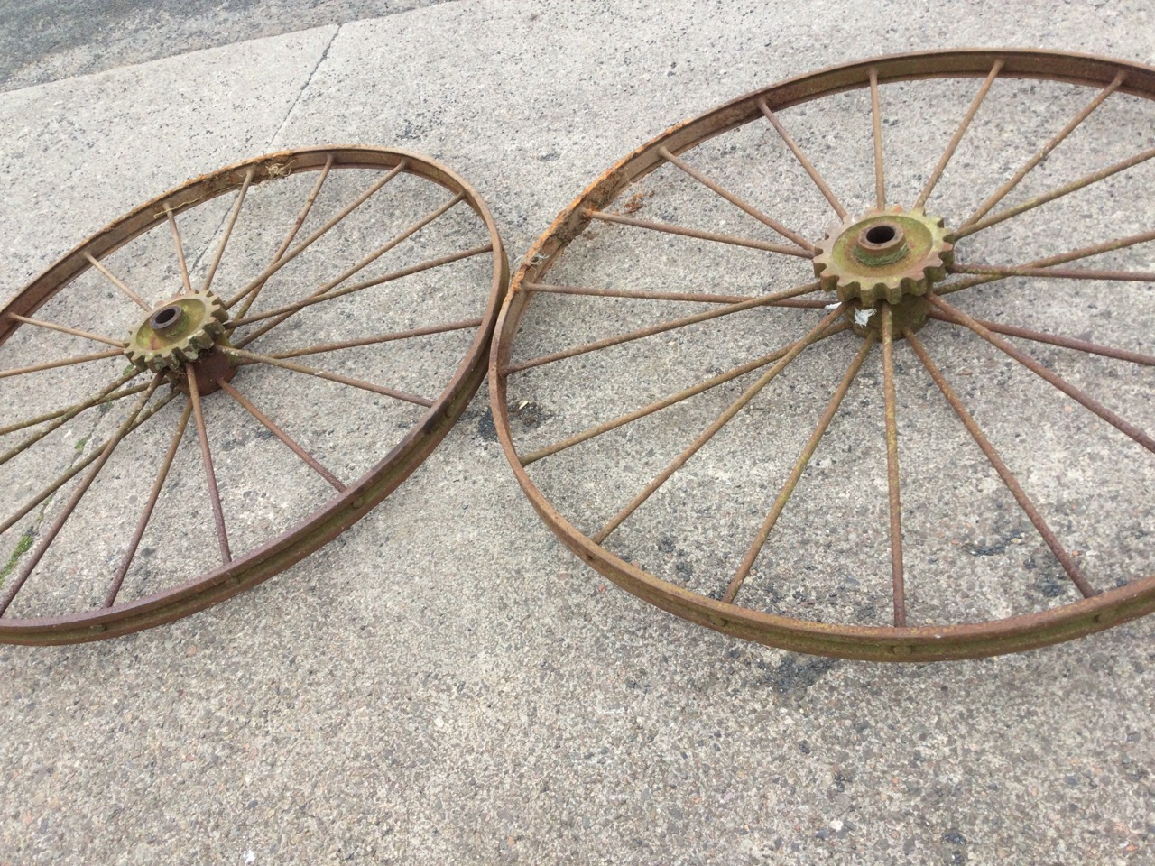 A pair of large agricultural wheels with channelled flat rims framing two sets of spokes with - Image 3 of 3