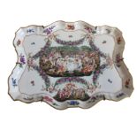 An Italian porcelain Capo-di-Monte style tray, moulded in relief with bachinalian scene of naked