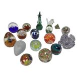 Fifteen glass paperweights, a marble pyramid shaped art glass paperweight, and a set of six glass