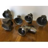 A collection of six carbide lamps from motorbikes/bicycles - various makers labels - Lucas Cadet,