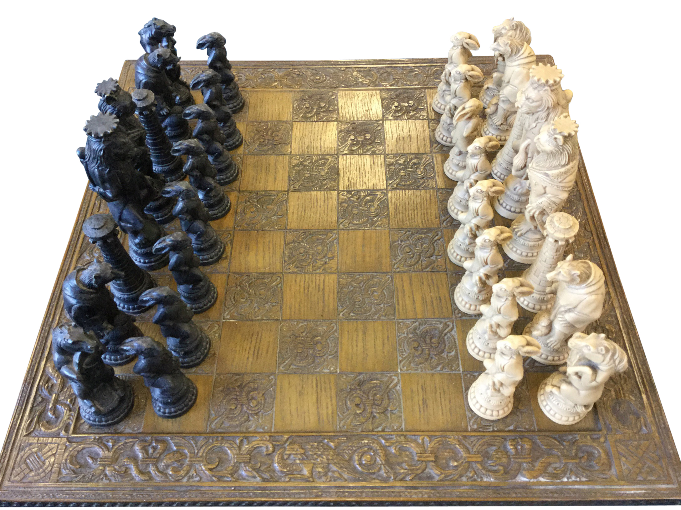 A composition Reynard the Fox chess set, with moulded figural prices including lions, wolves,