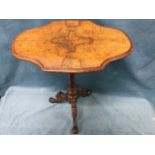 A Victorian walnut occasional table, the quarter veneered moulded top supported on a tapering spiral