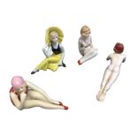 Four art deco style continental porcelain bathing belles, one naked, two with bathing costumes,