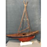 A large old clinker built painted pond yacht, having later additions, with leaded keel, new