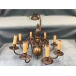 A Dutch style hanging brass chandelier with bulbous ball column supported by copper chain from