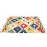 A kelim woven with coloured maltese type crosses on grey ground, with chequered yellow & maroon
