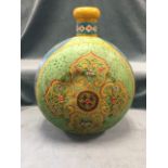 A giant handpainted flask of circular bun shape with tubular neck, with floral scrolled lotus panels