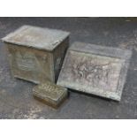 Two fireside brass boxes decorated with embossed rural scenes; and another smaller brass embossed