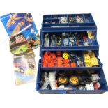 A Meccano set in a concertina toolbox with instruction plan books, wheels, nuts & bolts, motors,