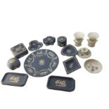 A collection of ten pieces of blue Wedgwood jasperware - ashtrays, trinket boxes & covers, a