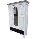 A painted late Victorian wardrobe with moulded cornice above an arched bevelled mirror door