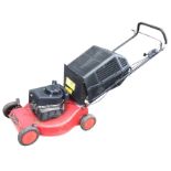 A Champion garden mower with petrol engine, complete with grassbox. (A/F)