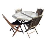 An octagonal folding teak garden table with four chairs, the slatted top with central hole for