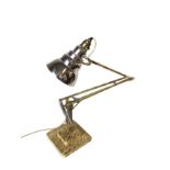 A Herbert Terry anglepoise lamp with sponged gilt decoration on cream ground, having square weighted