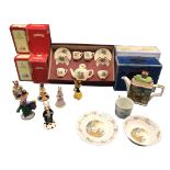 Six boxed Royal Doulton bunnykins figurines; a boxed Wedgwood Peter Rabbit mug & bowl; and a boxed