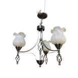 A contemporary hanging chromed three-branch ceiling light with twisted wrought iron decoration,