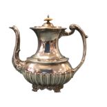 A Victorian silver coffee pot with gadrooned moulded decoration having acanthus leaf style handle