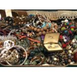 A large quantity of costume jewellery including bracelets, bangles, some silver, beads, earrings,