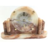 A British made art deco mantleclock in arched marble case framed by rounded pillasters, the gilt