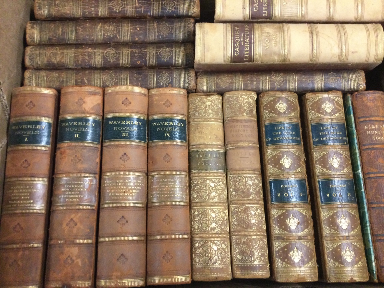 Leather bound books: Waverley Novels published in 1877 in four volumes; Constitutional History of