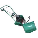 A Qualcast Bosch petrol garden mower with grassbox. (A/F)