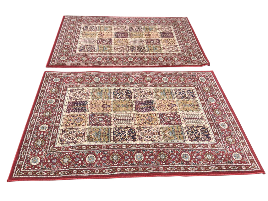 A pair of Egyptian made Valby Ruta rugs woven with rectangular fields of twenty four floral