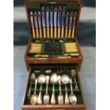 A 12-piece walnut cased canteen of silver plated cutlery by Reid & Sons Ltd, the set complete with