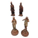 A pair of French painted spelter figures, she singing (13in)and he playing the flute (14in),