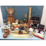 Miscellaneous collectors items including brass doorplates, torches, a carbide lamp, a roe skull on