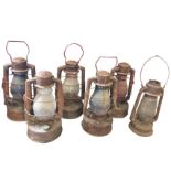 Six large rusty old hurricane lamps with glass shades - various makers names - Sherwoods of