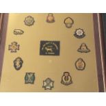 A framed case of embroidered military badges - The Lion Heart of Northumberland, Royal Engineers,