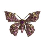 A cased 9ct gold butterfly brooch set with amethysts, peridots and small diamonds, having hinged pin