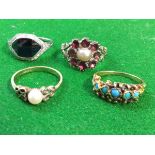 A 9ct gold ring set with single pearl, having pierced butterfly shoulders; a Victorian ruby