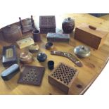 Miscellaneous treen including carved boxes, bowls, a boomerang, turnings, a dovetailed caddy type