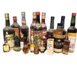 The residual contents of a booze cupboard including two bottles of Cockburns port, Martini, a bottle