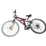 A Ridge Dakota mountain bike with sprung frame having soft seat, Falcon gears, twin forks, etc.