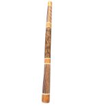 A 4ft tapering Australian didgeridoo, with geometric painted decoration and abstract bead