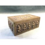 An Eastern silver plated box embossed with stylised dancing figures in gothic shaped panels on